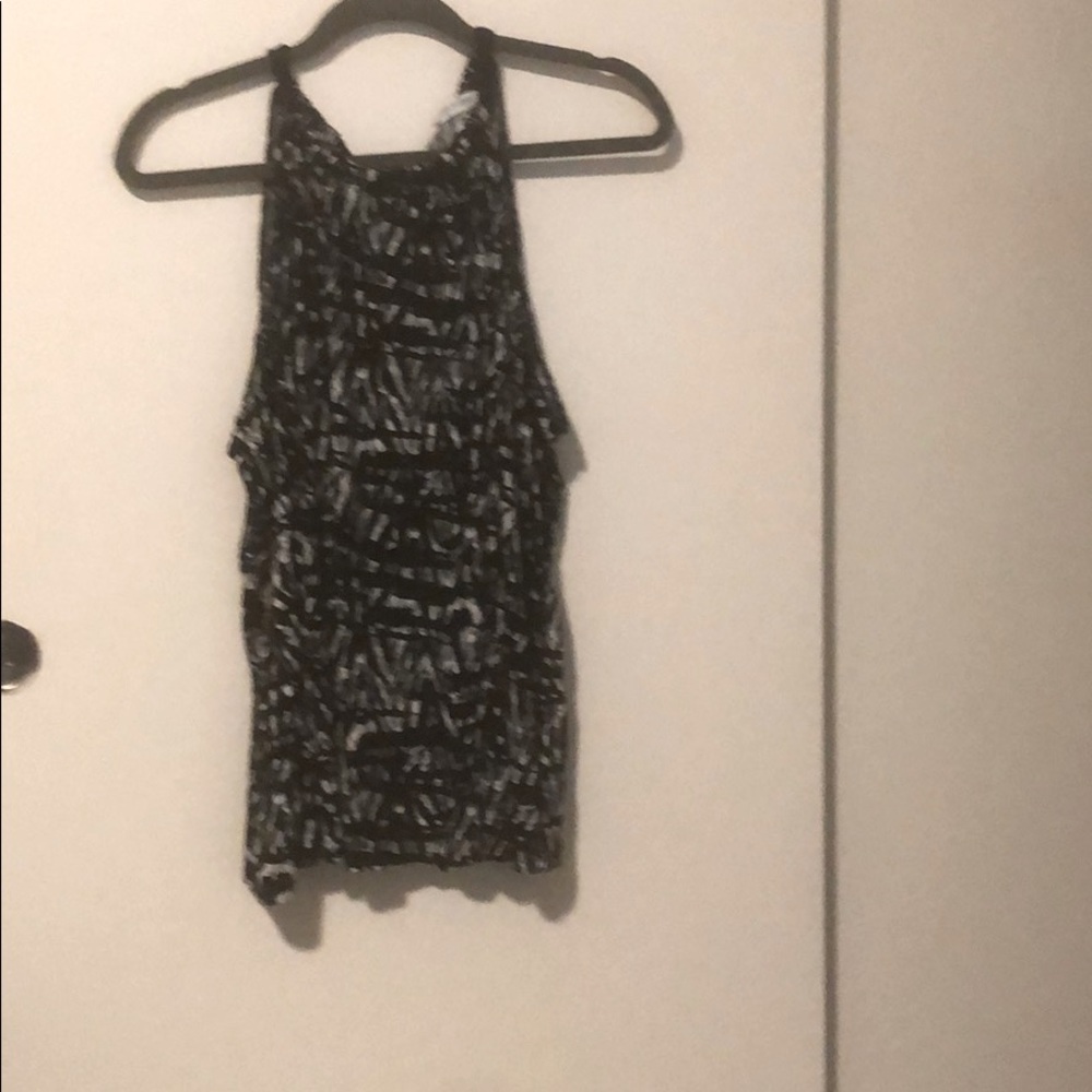 Black and white sleeveless top with fun neckline!